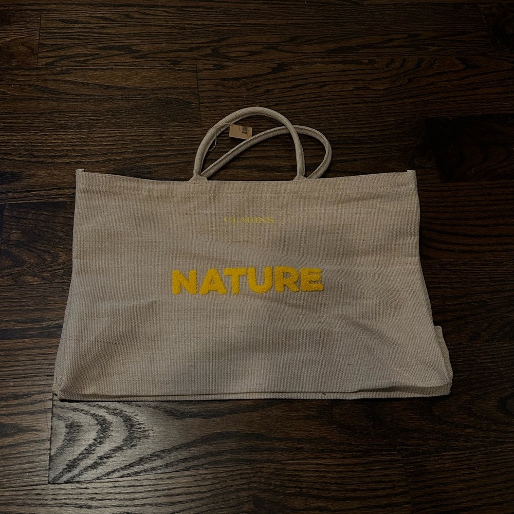 Clarins Beige Canvas Tote Bag with Yellow 'Nature' Print